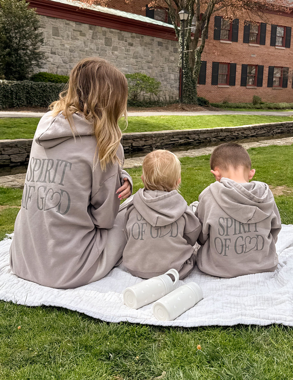 Family wearing Elevated Faith Kids Hoodie with Spirit of God design, showcasing Christian Kids Apparel