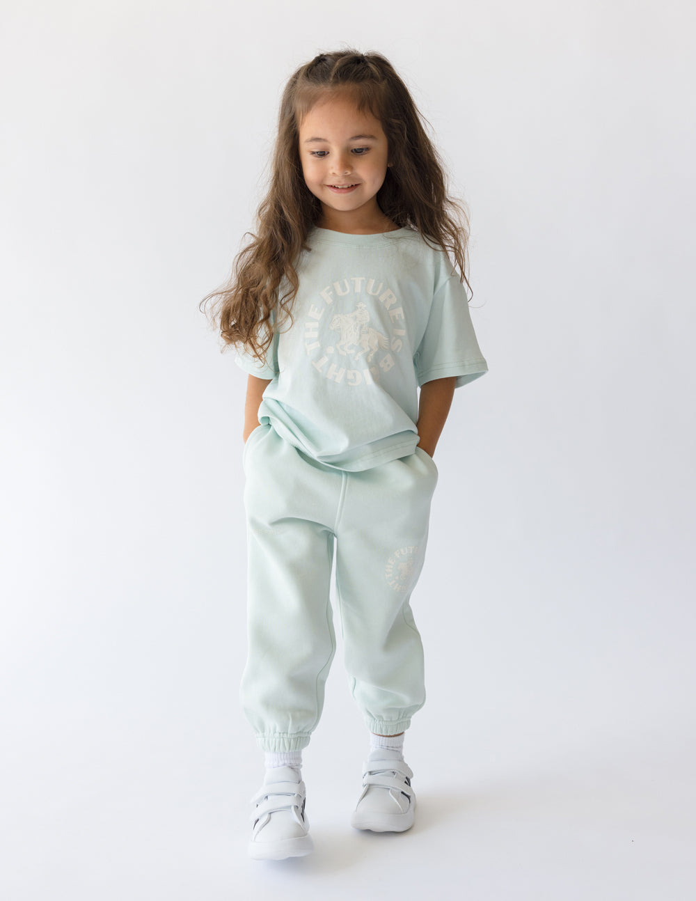 Girl wearing a light mint green kids t-shirt from Elevated Faith, featuring Christian Kids Apparel design