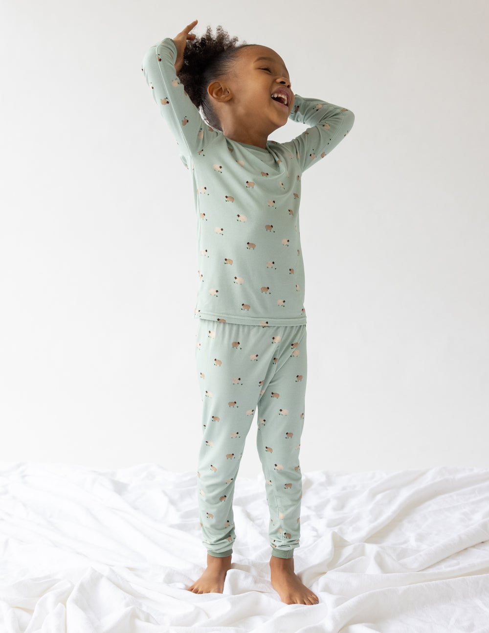 Light green kids pajama set featuring fun prints, ideal for comfortable sleep in Christian Kids Apparel