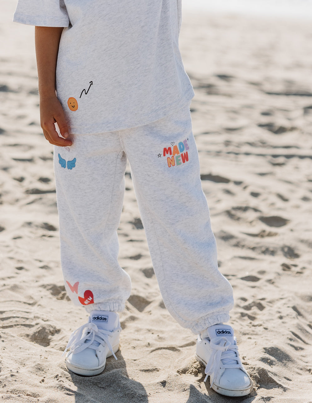 Light gray kids sweatpants with colorful graphics, part of Christian Kids Apparel by Elevated Faith