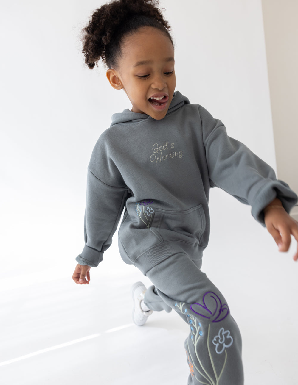 Elevated Faith Kids Hoodie in Gray with 'God's Working' Message, part of Christian Kids Apparel