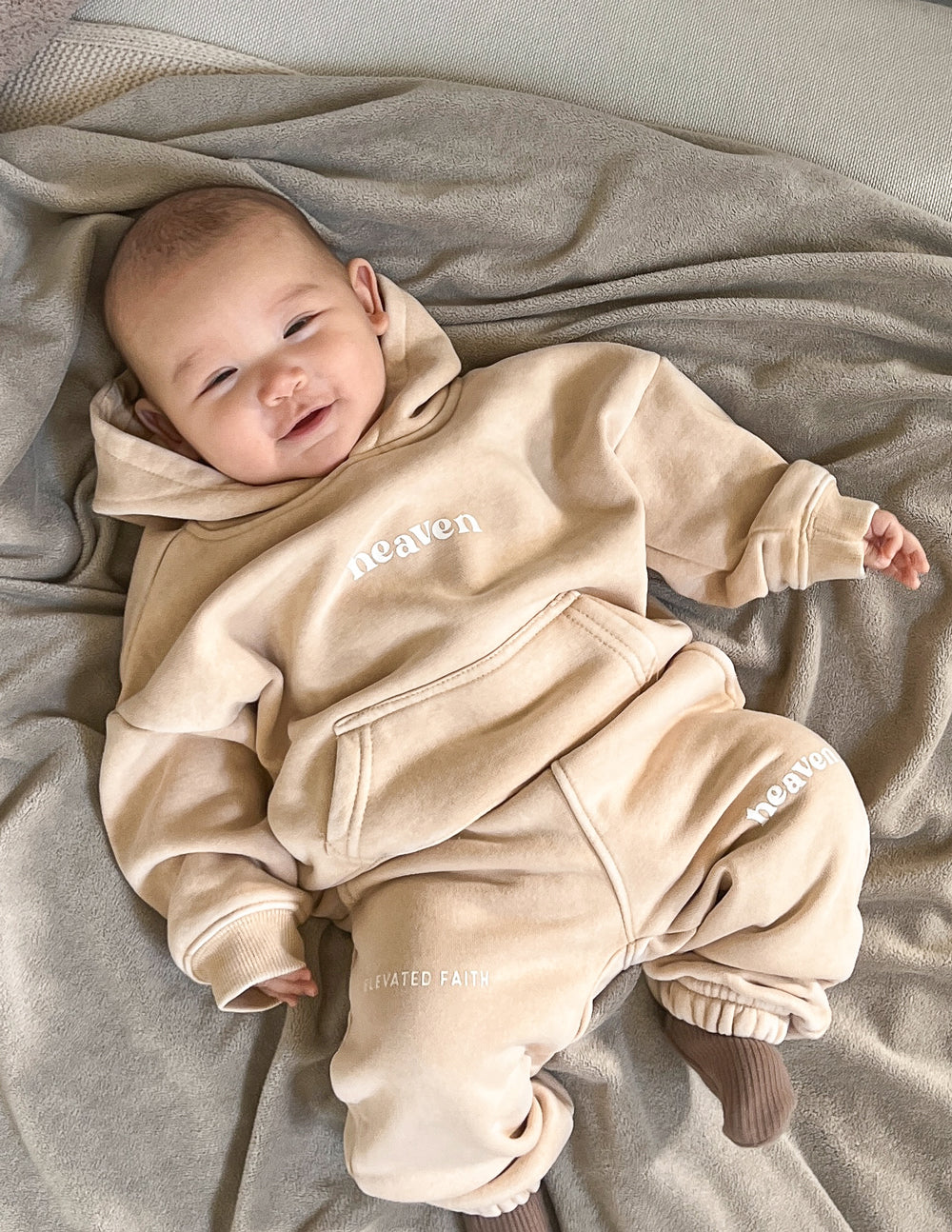 Cozy beige kids hoodie from Elevated Faith featuring heaven design, perfect Christian Kids Apparel.