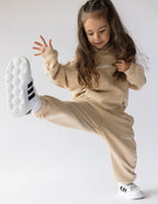 Beige Kids Hoodie from Elevated Faith with 'heavens' print, part of Christian Kids Apparel collection