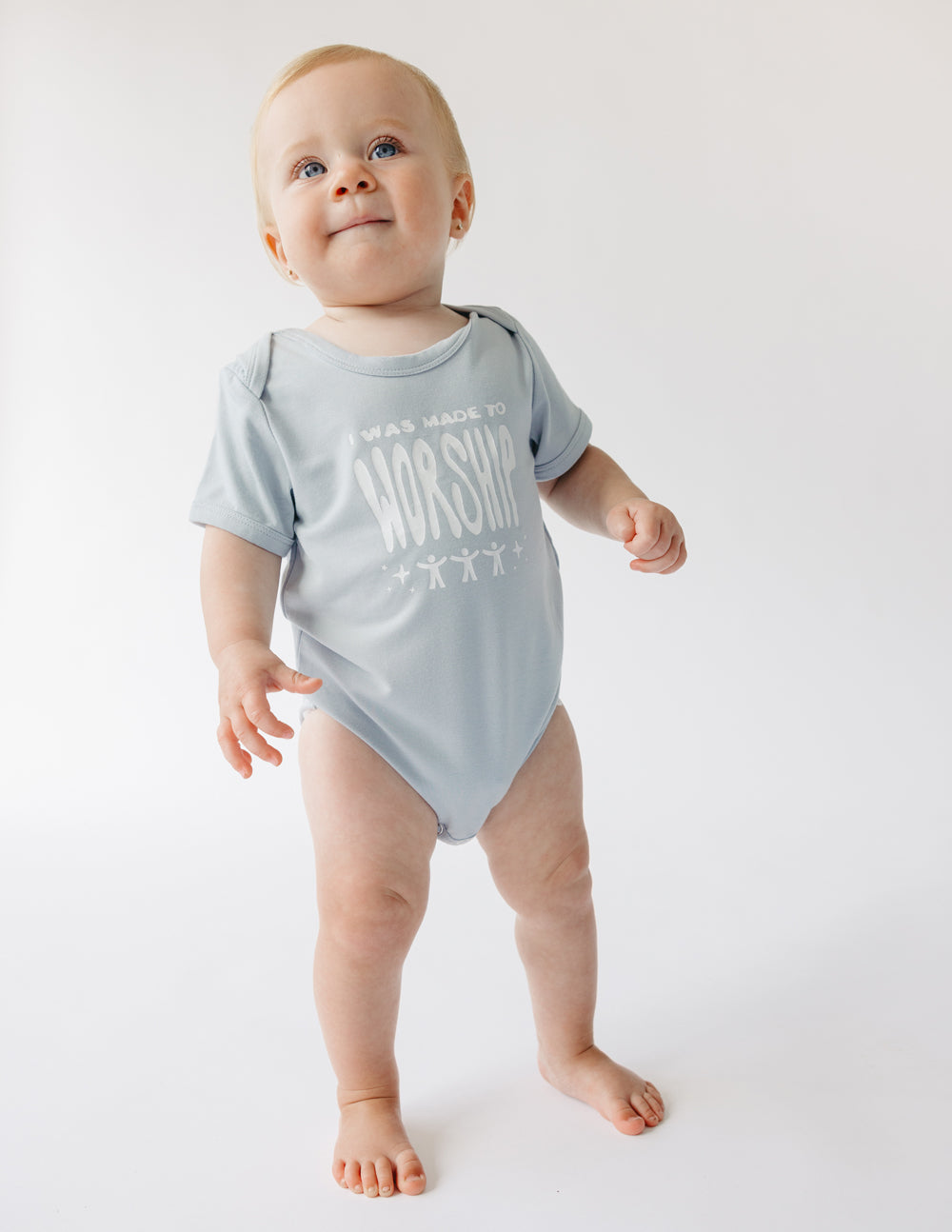 Light blue onesie reading We are made to worship for Christian Kids Apparel by Elevated Faith