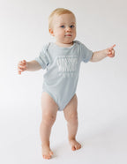 Light Blue Onesie from Elevated Faith with 'We Are Made to Worship' Design for Christian Kids Apparel