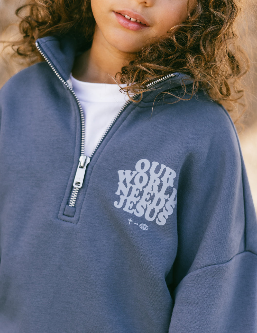 Elevated Faith Kids Jacket in Navy with 'Our World Needs Jesus' Print for Christian Kids Apparel
