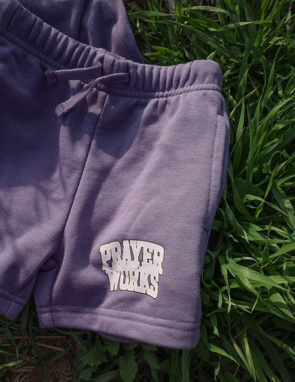 Purple Kids Shorts from Elevated Faith featuring 'Prayer Works' in Christian Kids Apparel style