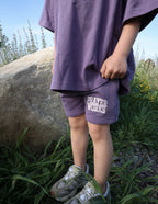 Purple Kids Shorts by Elevated Faith featuring 'Prayer Works' design, perfect Christian Kids Apparel