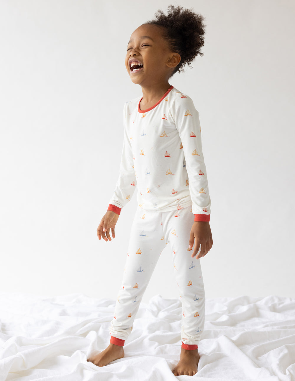 Elevated Faith Christian Kids Apparel featuring playful sailboat design in soft pajamas for children