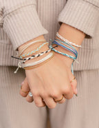 Colorful Elevated Faith Christian Jewelry Bracelet stacked on a person's wrists for a trendy look