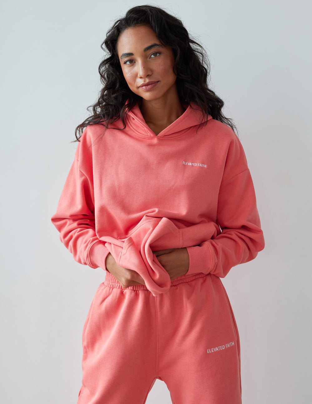 Elevated Faith Christian Hoodie in Coral Pink with a Soft, Cozy Fit for Everyday Wear