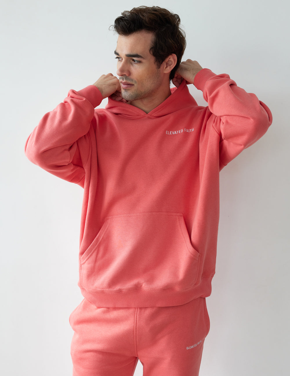 Elevated Faith Christian Hoodie in Coral with Front Pocket and Adjustable Hood