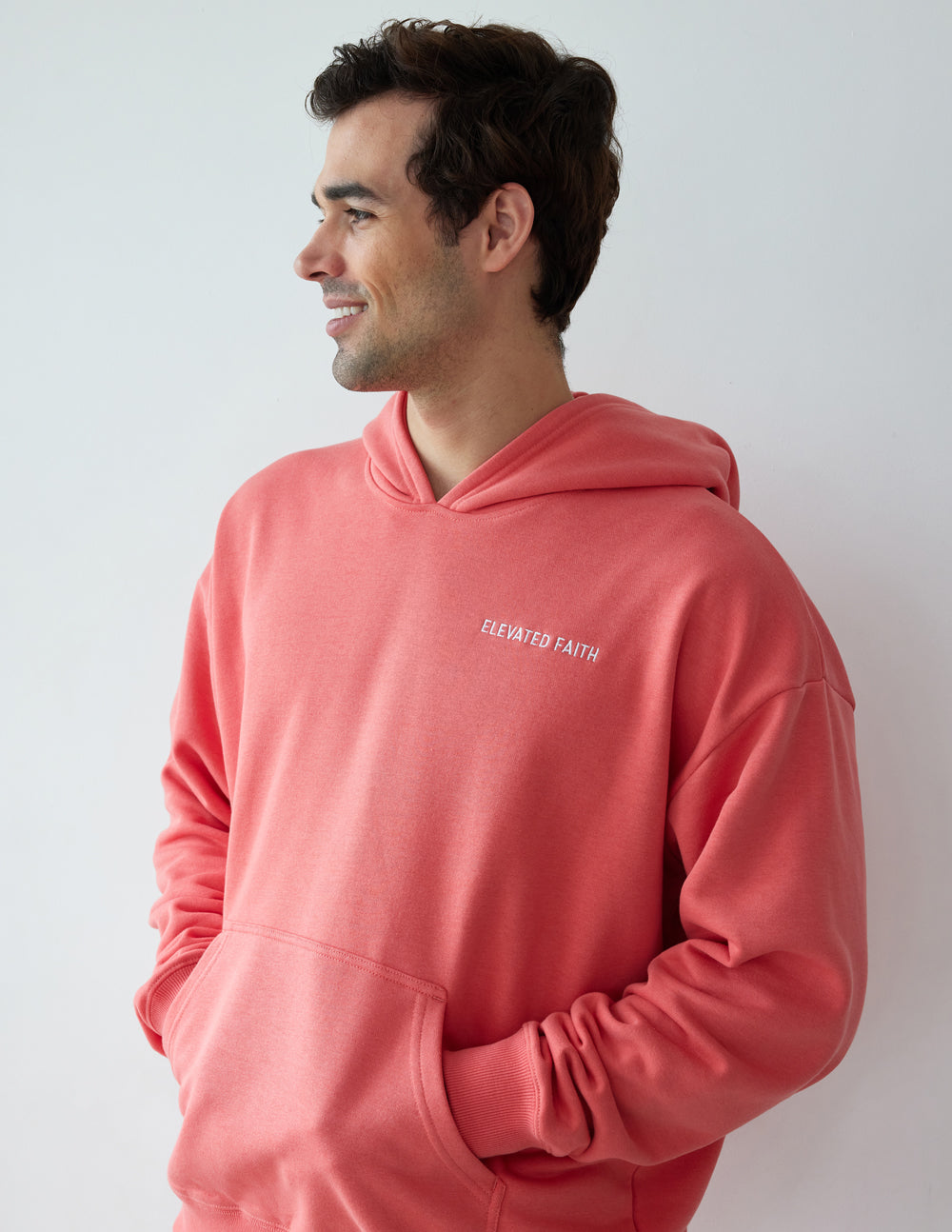 Men's Elevated Faith Christian Hoodie in Coral with Front Pocket and Relaxed Fit