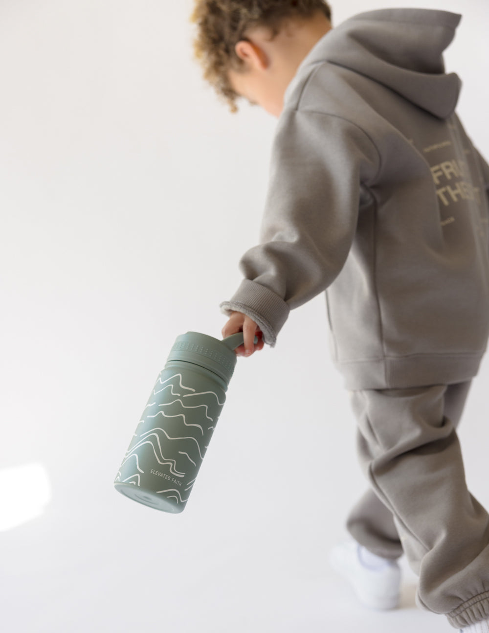 Kids Water Bottle from Elevated Faith designed for Christian Kids Apparel with a stylish wave pattern