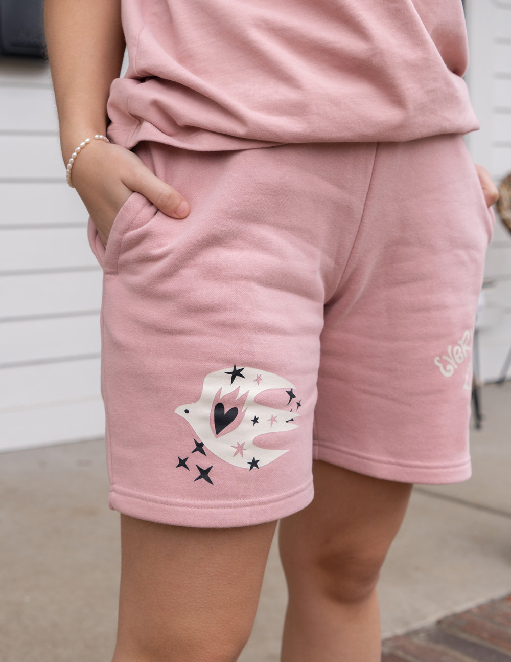 Elevated Faith Christian Shorts in pink with dove and star design and side pockets