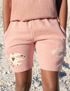 Elevated Faith Christian Shorts in soft pink with heart graphic and pockets for casual wear