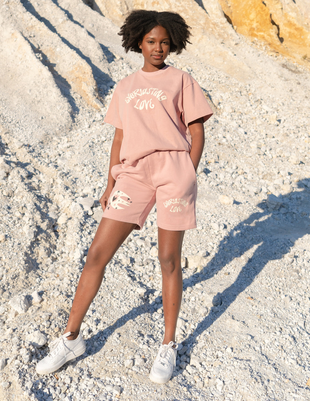 Elevated Faith Christian Shorts in pink with distressed details and 'Working in Love' graphic