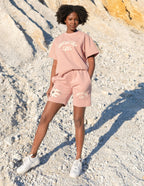 Elevated Faith Christian Shorts in pink with distressed details and 'Working in Love' graphic