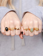 Assorted gold rings from Elevated Faith featuring designs perfect for Christian jewelry