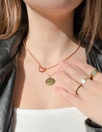 Elevated Faith Christian Jewelry Necklace featuring a heart pendant and a textured charm