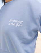 Light blue Christian Crewneck Sweatshirt with 'Growing with God' text print for casual wear