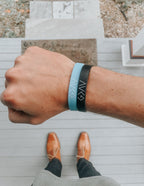 Elevated Faith Christian Jewelry Bracelet in blue and black worn on wrist for stylish faith expression