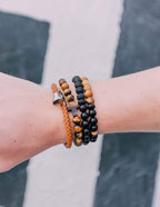 Elevated Faith Christian Jewelry Bracelet featuring stone beads and braided designs on a wrist