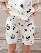Elevated Faith Christian Shorts in cream featuring playful graphic prints and comfortable fit