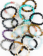 Variety of Elevated Faith Christian Bracelets featuring colorful stone beads and unique designs