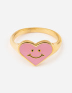 Heart-shaped gold ring with pink smiley face, perfect for Christian jewelry lovers